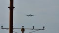 Plane flying, silhouette, closeup view from below the plane Royalty Free Stock Photo