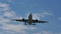 Plane flying, silhouette, closeup view from below the plane Royalty Free Stock Photo