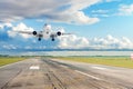 Passenger plane is landing runway from airport Royalty Free Stock Photo