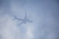 Passenger plane passing through the clouds Royalty Free Stock Photo