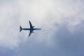 Passenger plane passing through the clouds Royalty Free Stock Photo
