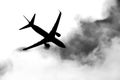 Passenger plane passing through the clouds Royalty Free Stock Photo