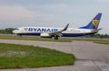 Passenger plane RYANAIR airline. Airport apron. Aircraft Boeing 737-8AS travel on runway. Airplane SP-RKE arrives. Aero