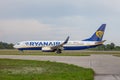 Passenger plane RYANAIR airline. Airport apron. Aircraft Boeing 737-8AS travel on runway. Airplane SP-RKE arrives. Aero Royalty Free Stock Photo