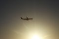 Passenger plane in the sky at sunrise or sunset. Vacation and travel concept. Toned image Royalty Free Stock Photo