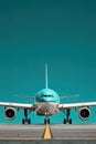 Passenger plane soaring through a clear blue sky while flying over clouds Royalty Free Stock Photo