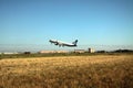 Passenger plane takes off from the airport runway Royalty Free Stock Photo