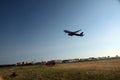 Passenger plane takes off from the airport runway Royalty Free Stock Photo