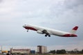 Passenger plane takes off from the airport runway. Side-view of aircraft Royalty Free Stock Photo