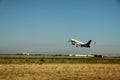 Passenger plane takes off from the airport runway Royalty Free Stock Photo