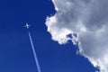 a passenger plane with vapour trails Royalty Free Stock Photo