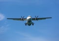 Passenger propeller airplane before landing