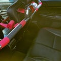 Passenger seat of car with red seat belts Royalty Free Stock Photo