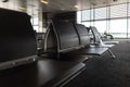 Passenger seat in Departure lounge where passengers can wait boarding to aircraft, view from airport terminal. Transport Royalty Free Stock Photo