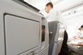 Passenger seat of plane with screen. Royalty Free Stock Photo