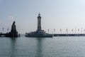 Passenger ship enters the protected harbor on Lindau Island on Lake Constance in Bavaria Royalty Free Stock Photo