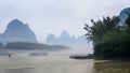 passenger ships in mist over river near Xingping Royalty Free Stock Photo
