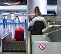 Passenger standing at the front desk for the flight, Moscow, Russia