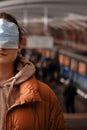 A passenger on the subway shows how to wear a mask on his face incorrectly