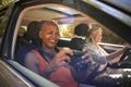 Passenger Taking Photo With Camera As Two Senior Female Friends Enjoy Day Trip Out In Car Royalty Free Stock Photo