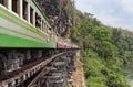 Passenger thai train moving on death of railway world war II between tham krasae railway station Thailand Royalty Free Stock Photo