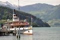 The passenger tourist steam boat leaving pier in central Switzerland