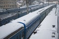 passenger train cars at the station in winter Royalty Free Stock Photo