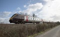 Passenger train an embankment in Devon UK