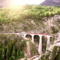 Passenger train goes from St. Moritz to Chur. Royalty Free Stock Photo