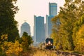 Passenger Train Leaving City in Summer Royalty Free Stock Photo