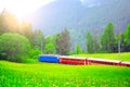 Passenger train moves from Davos to Chur. Royalty Free Stock Photo