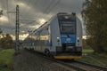 Passenger train near small station in autumn clean day in Bludov CZ 11 04 2023