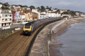 Passenger train passing Dawlish a seaside town in Devon England UK