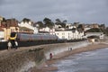 Passenger train passing Dawlish a seaside town in Devon England UK