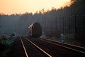 Passenger train passing through the forest Royalty Free Stock Photo
