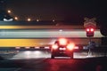 Passenger train passing by railroad crossing