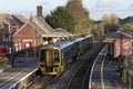 Passenger train at the platform of Crediton Station, Devon, UK.