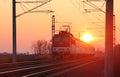 Passenger train on railway at sunset Royalty Free Stock Photo