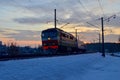 Passenger train on railway at sunset Royalty Free Stock Photo