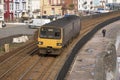 Passenger train on the seawall at Dawlish in Devon UK Royalty Free Stock Photo