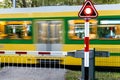 Passenger train speeding through a level crossing Royalty Free Stock Photo