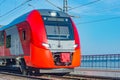 Passenger train stands along the platform by the Black sea coast. Sochi Royalty Free Stock Photo