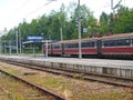 A passenger train stands near the railway station `s desert apron. Zakopane, Poland. Polish text - Zakopane Royalty Free Stock Photo