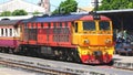 Passenger train stops at a platform at Bang Sue Junction