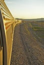 Passenger train traveling into the Arizona sunset Royalty Free Stock Photo