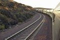 Passenger train traveling into the Arizona sunset Royalty Free Stock Photo