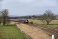 Passenger train travels south of Exeter in Devon UK Royalty Free Stock Photo