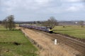 Passenger train travels south of Exeter in Devon UK Royalty Free Stock Photo