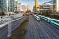 Passenger Trains near a Station on a Sunny Winter Day Royalty Free Stock Photo