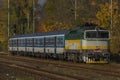 Passenger trains in station Kralovo Pole in Brno city in autumn color day